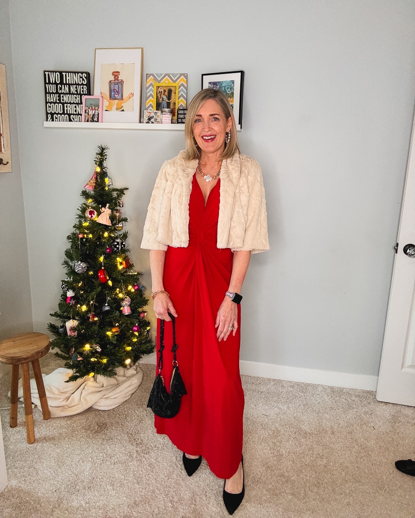 dressy holiday party outfit - red maxi dress, fux fur shrug, black pumps, rhinestone bag