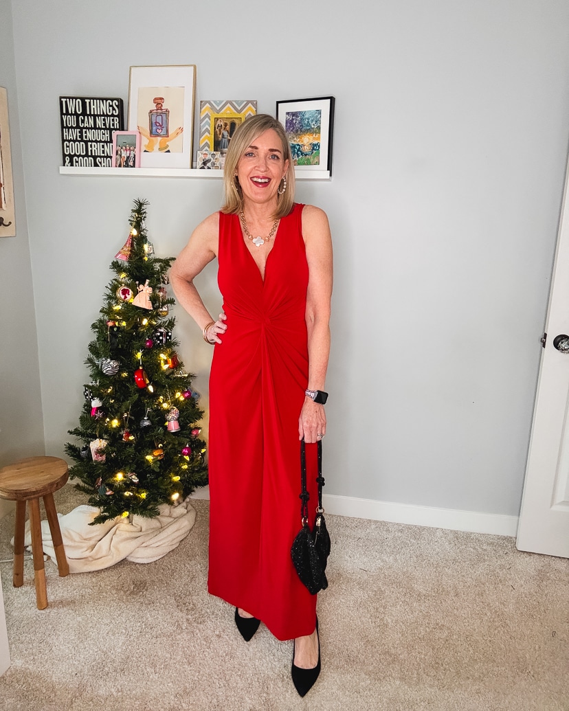 dressy holiday outfit - red maxi dress, black pumps and sequin bag