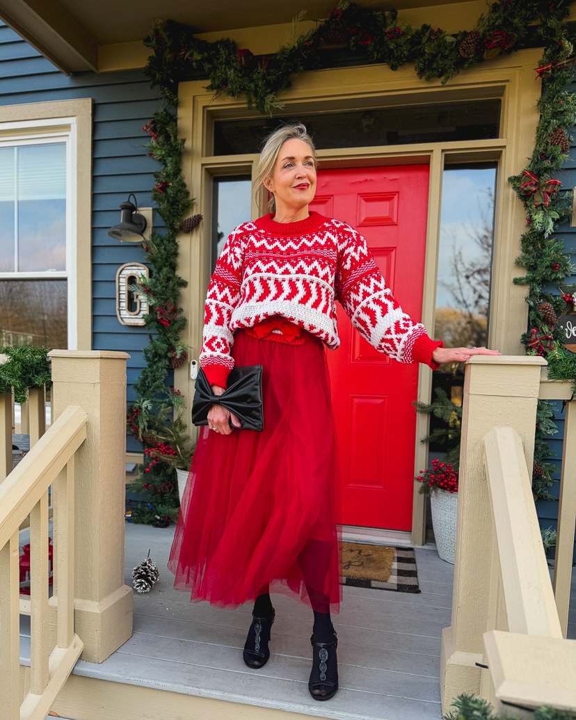 woman wearing red fair isle sweater and tulle skirt for a warm and festive Christmas outfit